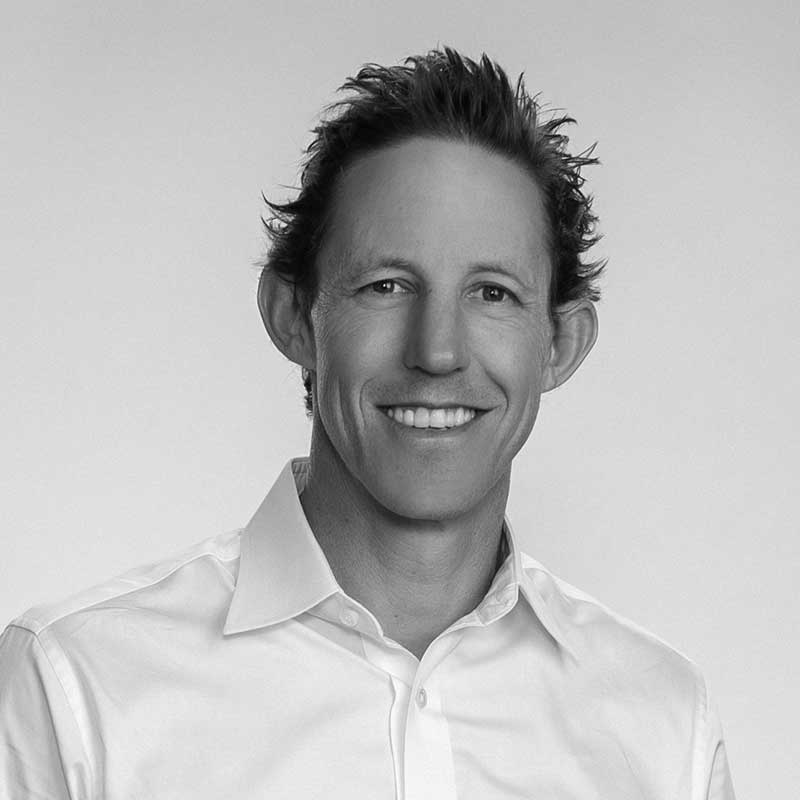 A black and white photo of Senior Vice President of Project Development for LDK Ventures, Josh Leachman.